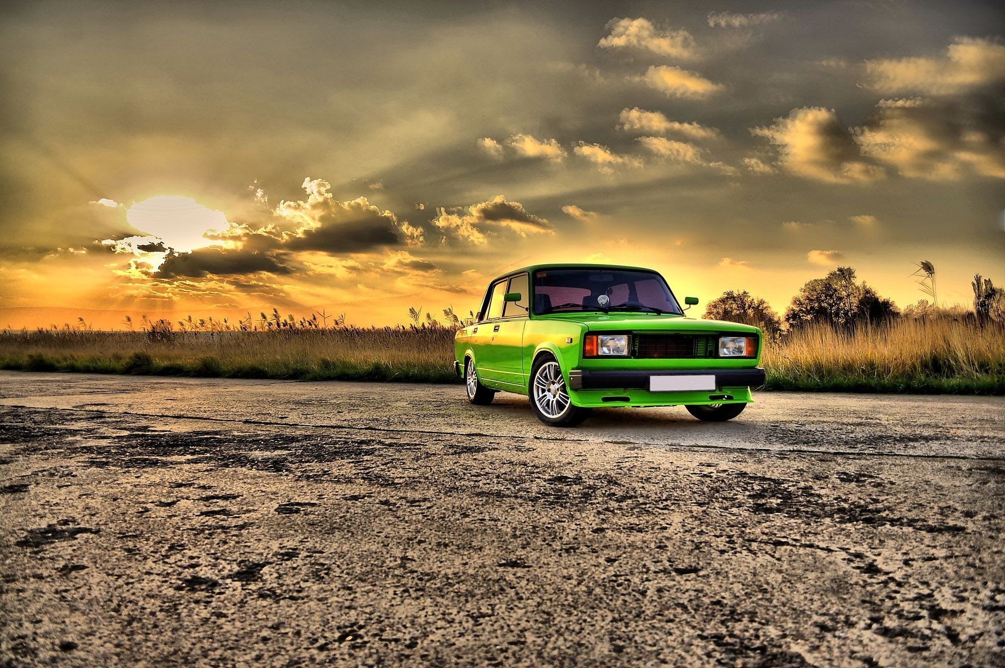 Green car at sunset