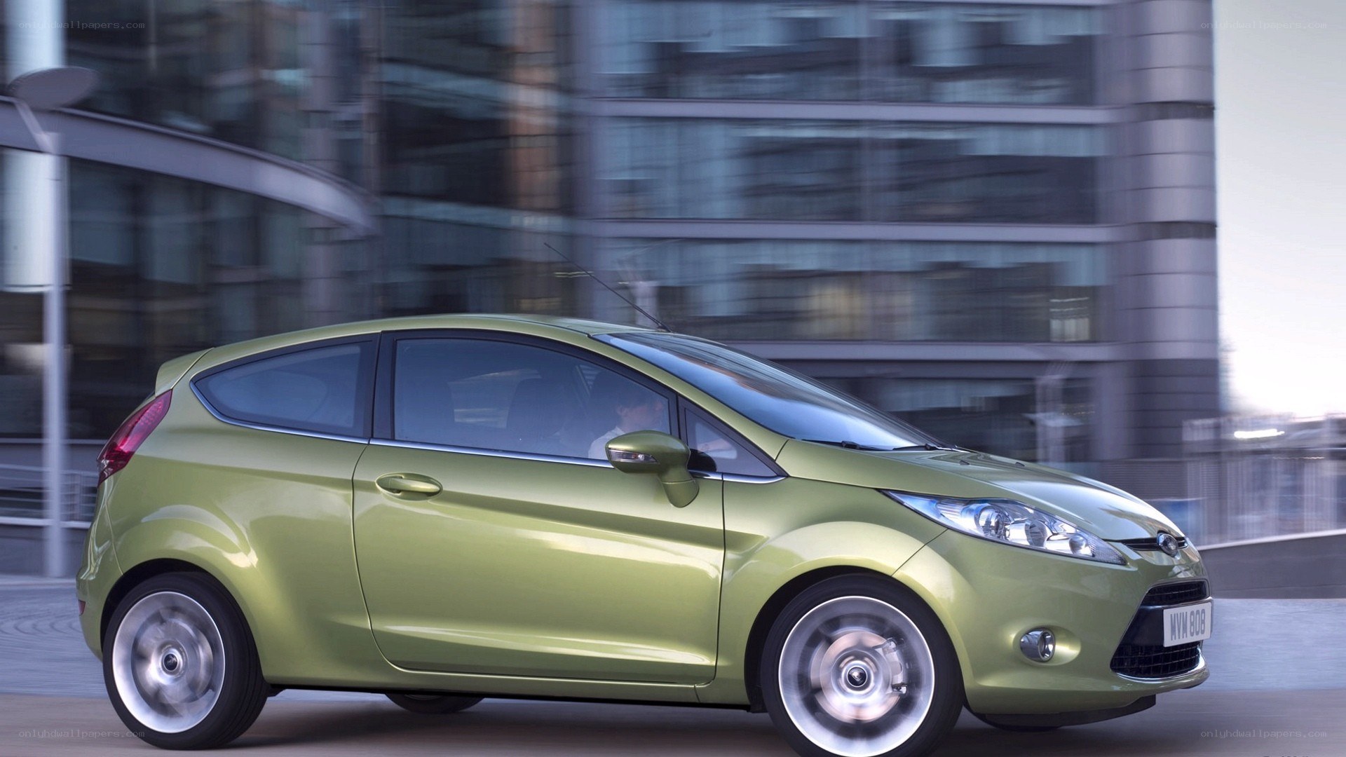 green car in city