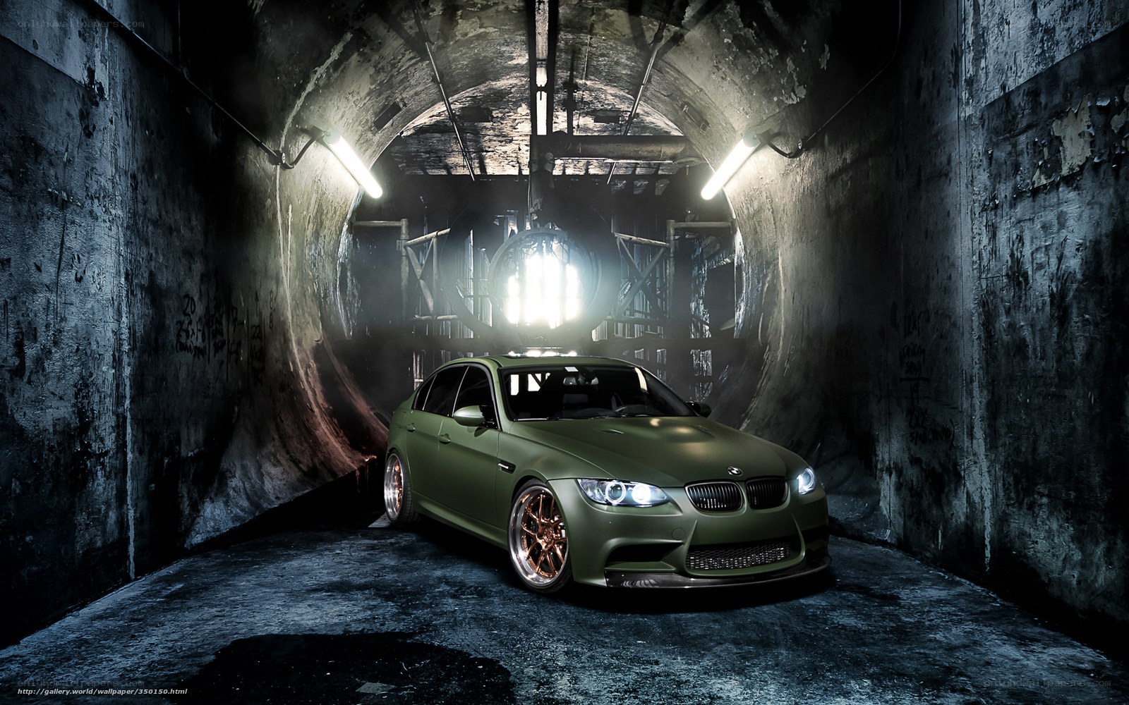 green car in dark tunnel