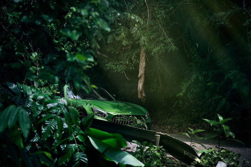 Green Car in Forest — Dramatic