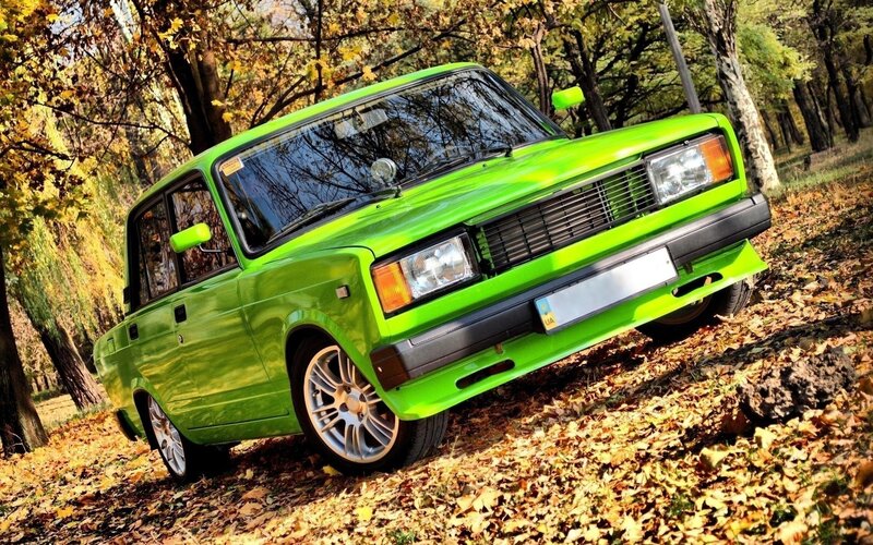 Green Car in Forest — Serene