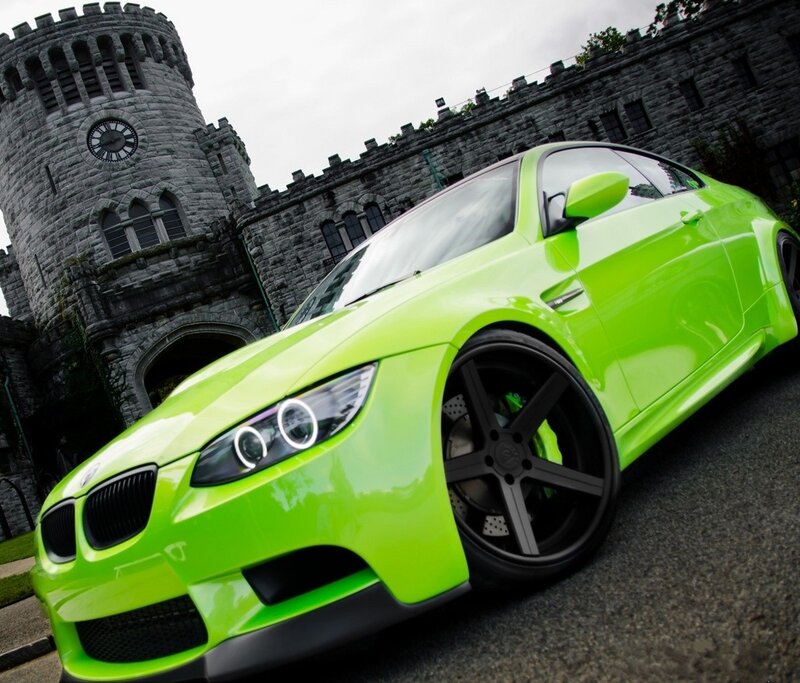 green car in front of castle