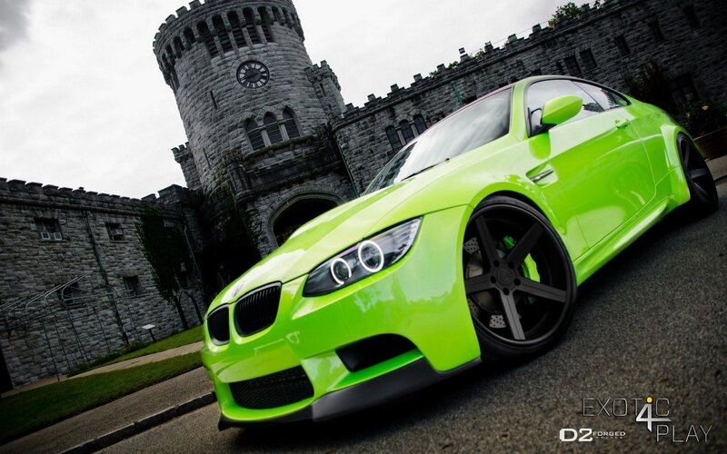 green car in front of castle