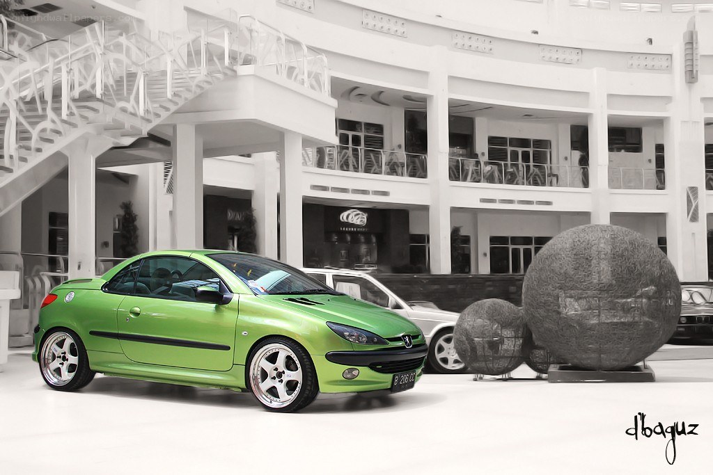Green car in modern building