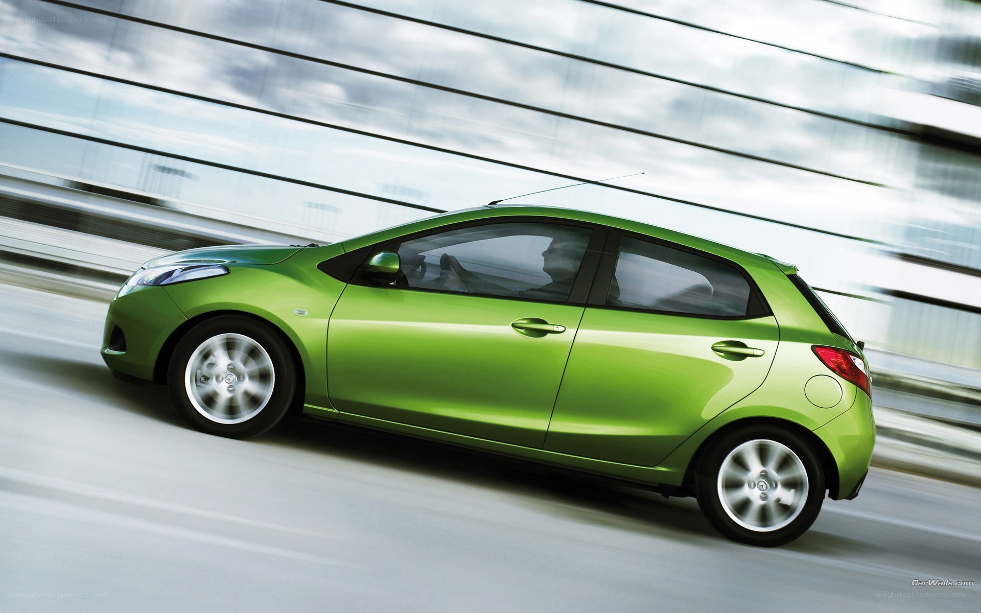 green car in motion