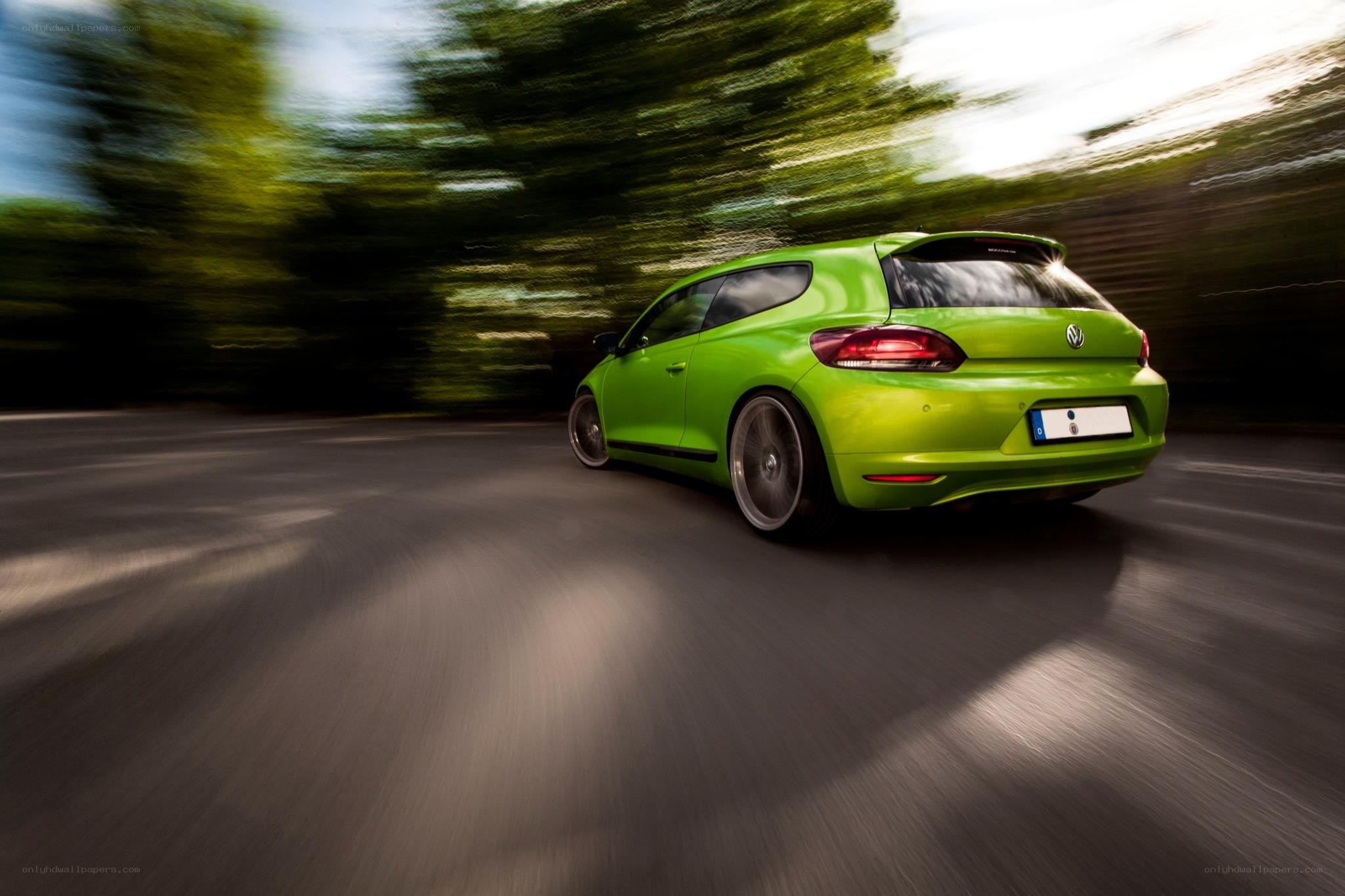 green car in motion