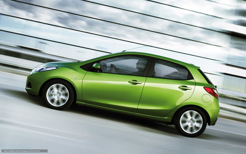 green car in motion