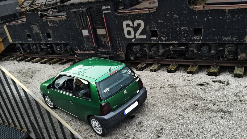 Green Car Near Train