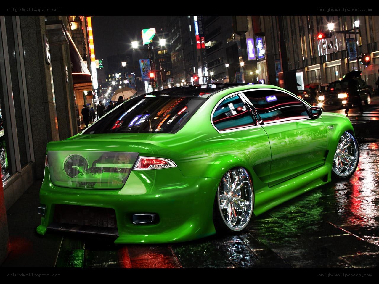 green car on city street