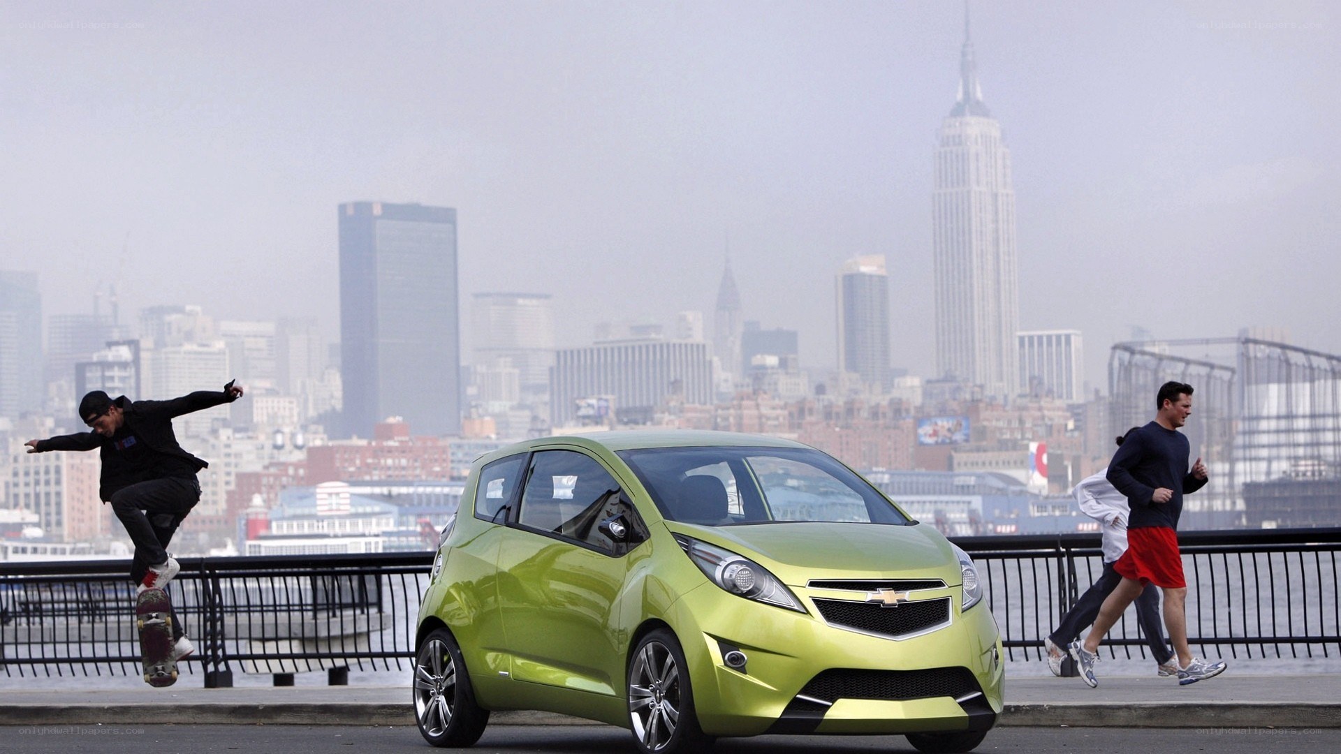 Green car on city waterfront