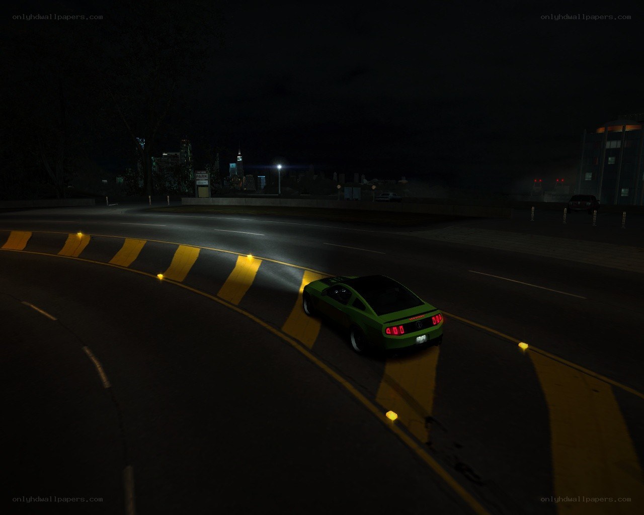 green car on night road