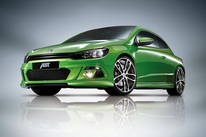 Green Car on Reflective Surface — Dramatic