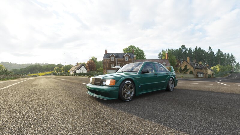 Green Car on Road — Calm, Morning