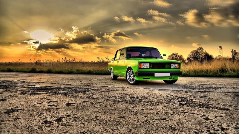 Green Car on Road — Dramatic, Sunset, Photograph, Sky