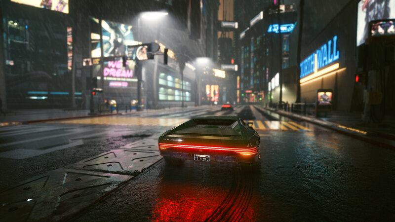 Green Car on Wet Street