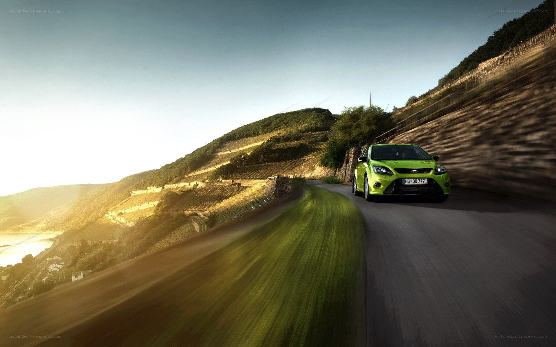 Green car on winding road