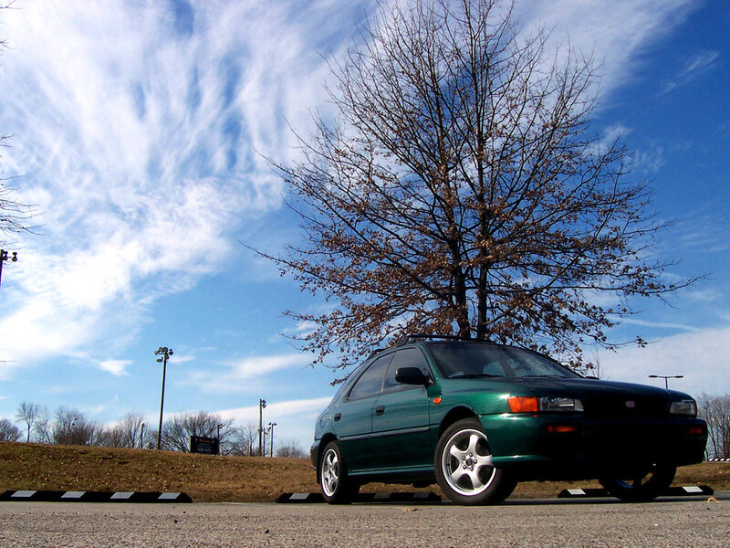 green car under blue sky