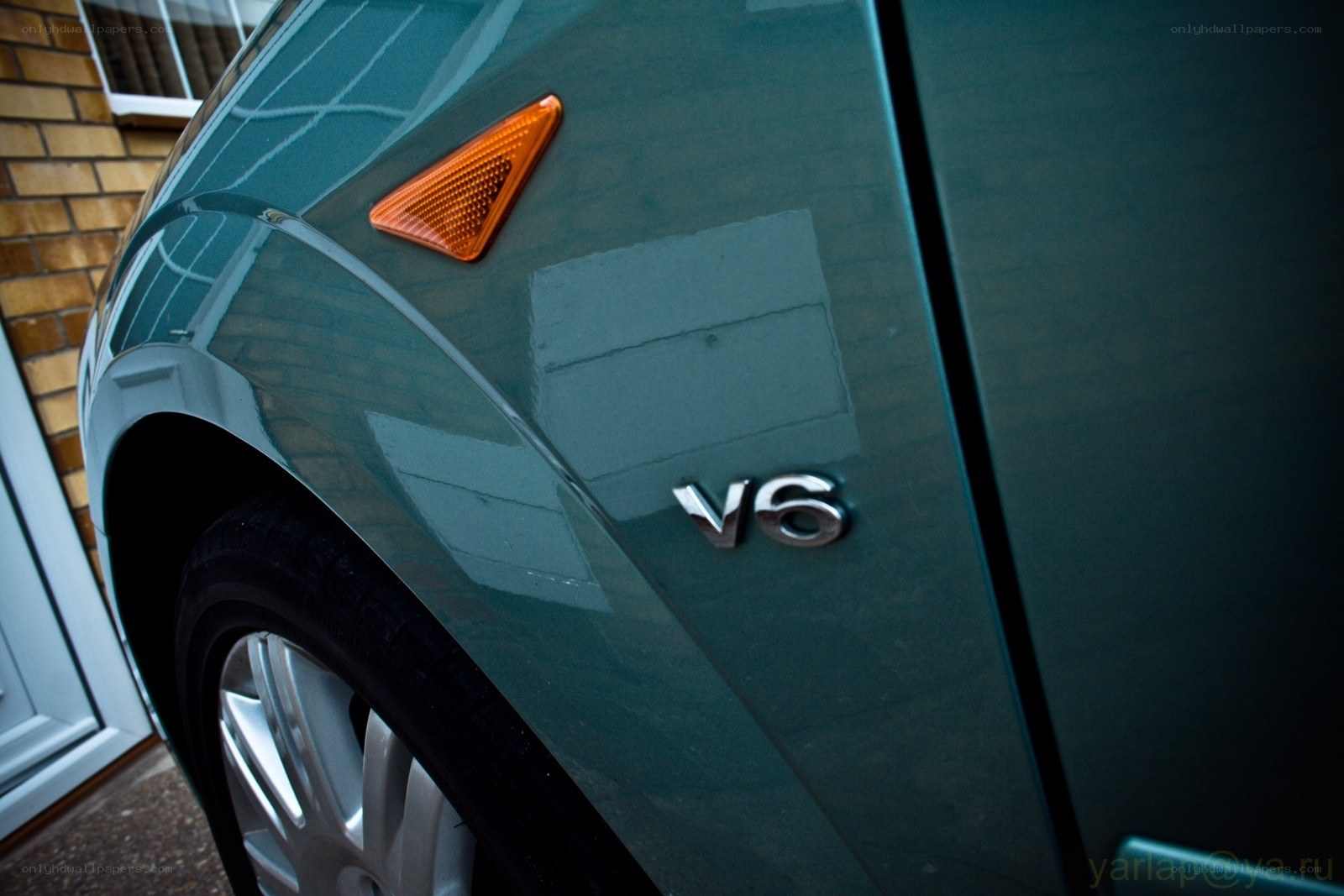 green car v6 badge