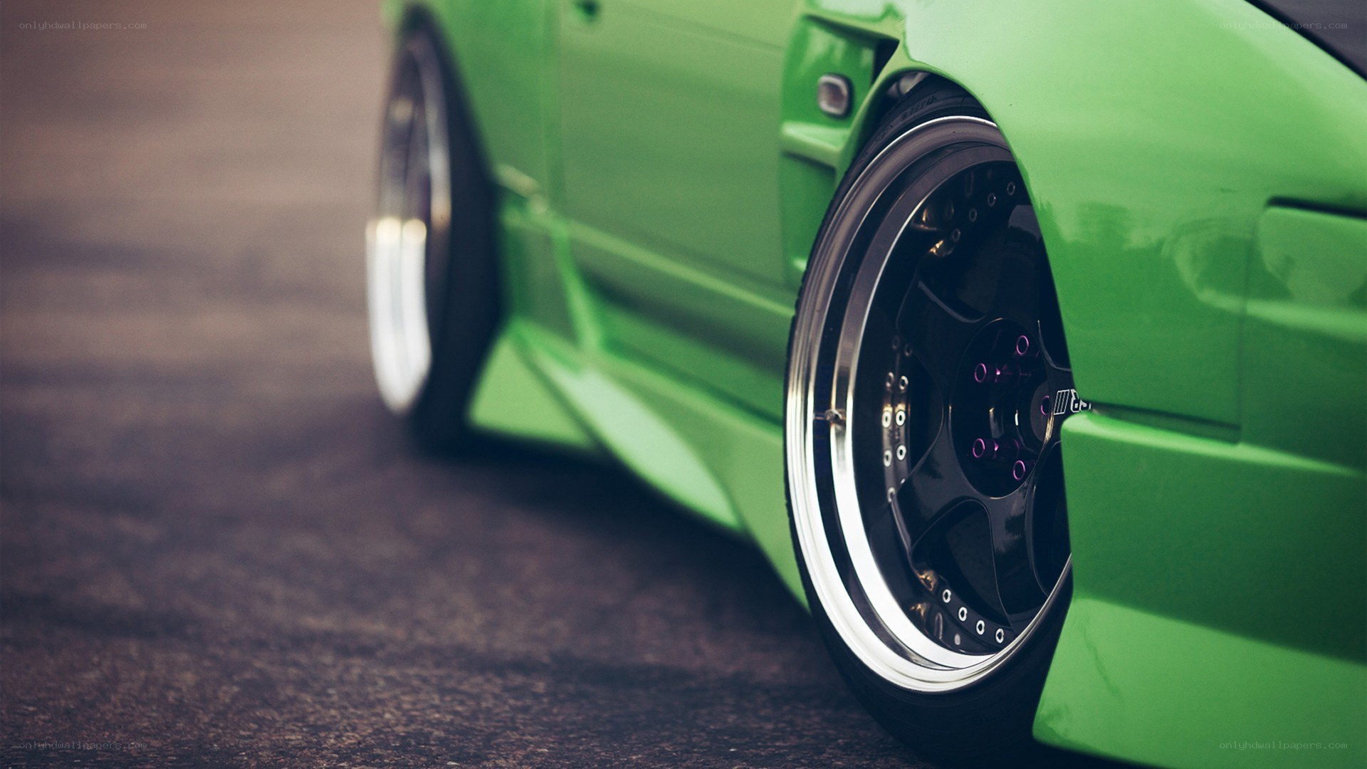 green car wheel close-up