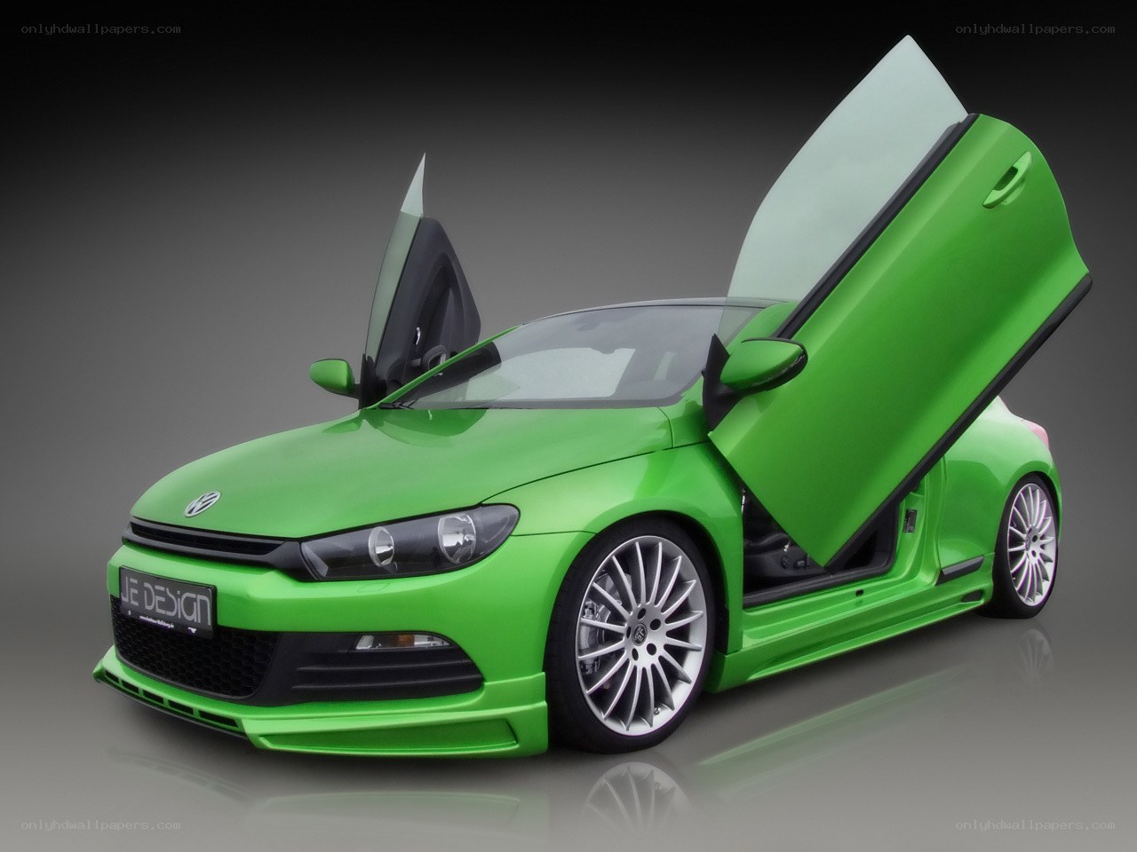 green car with doors open