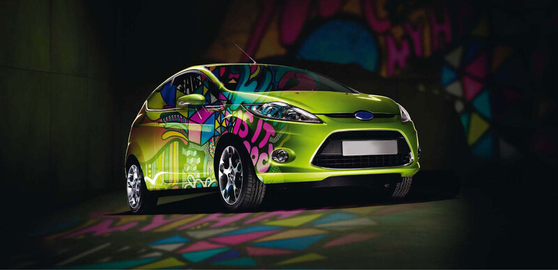 Green Car with Graffiti