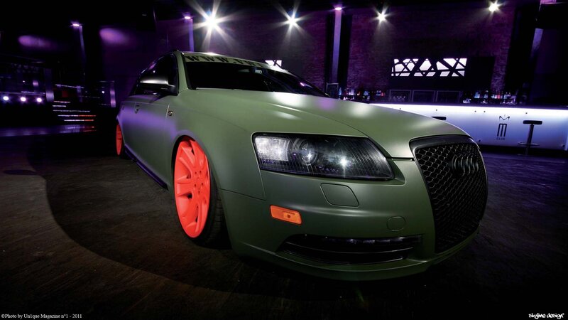 green car with red wheels