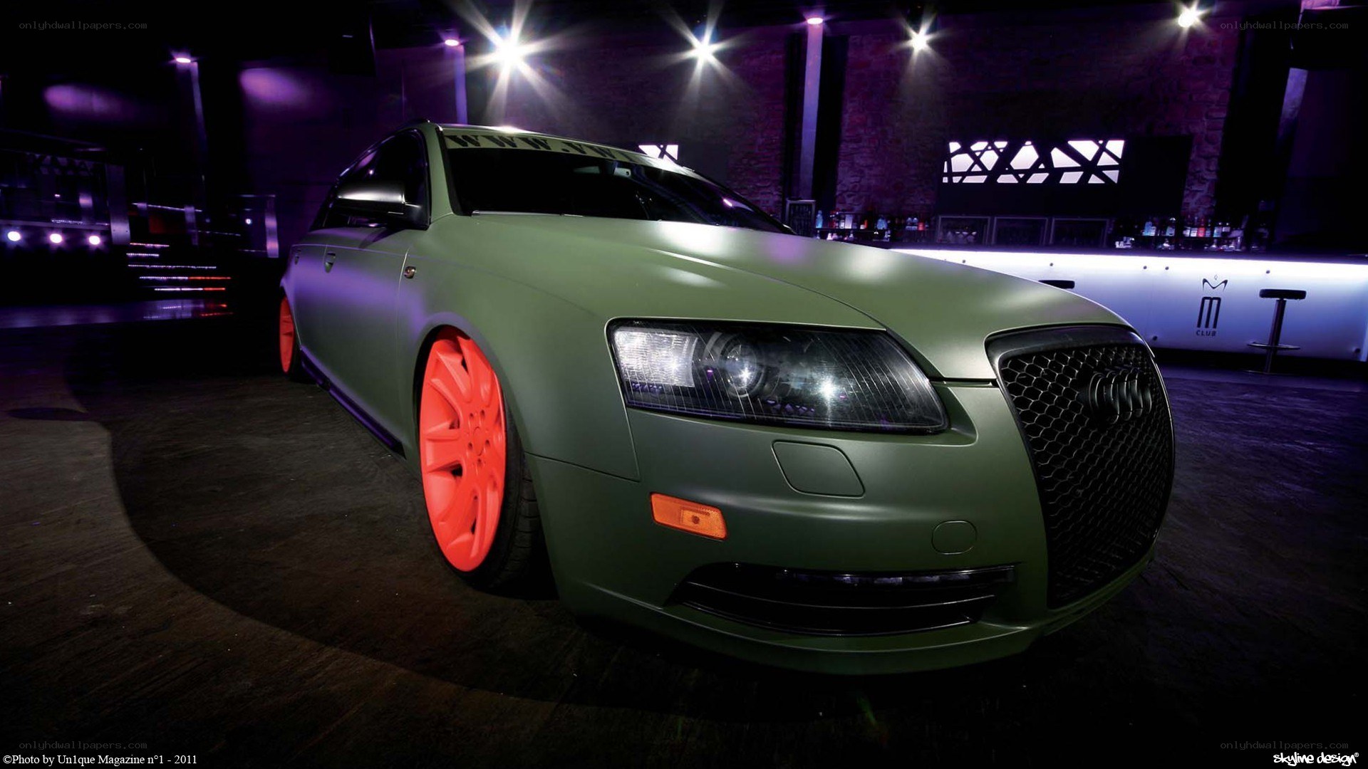 green car with red wheels