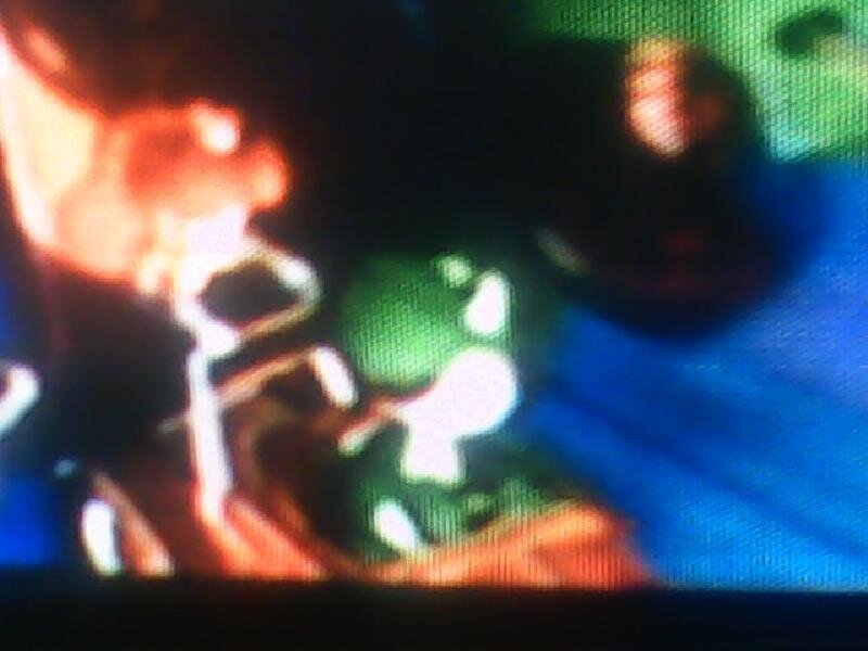 Green Character in Dark Scene