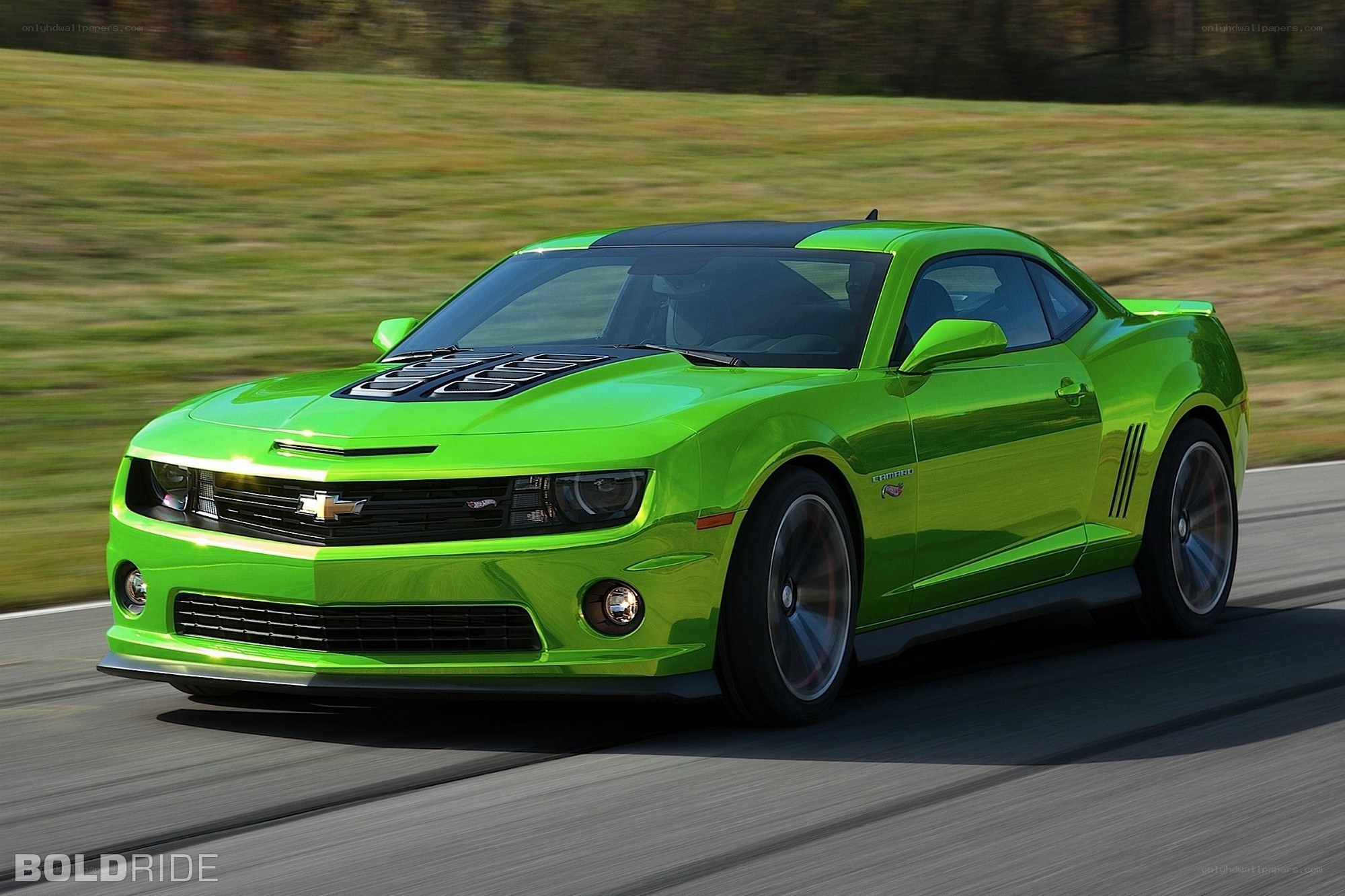 green chevrolet camaro in motion