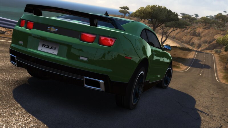 green chevrolet camaro on coastal road