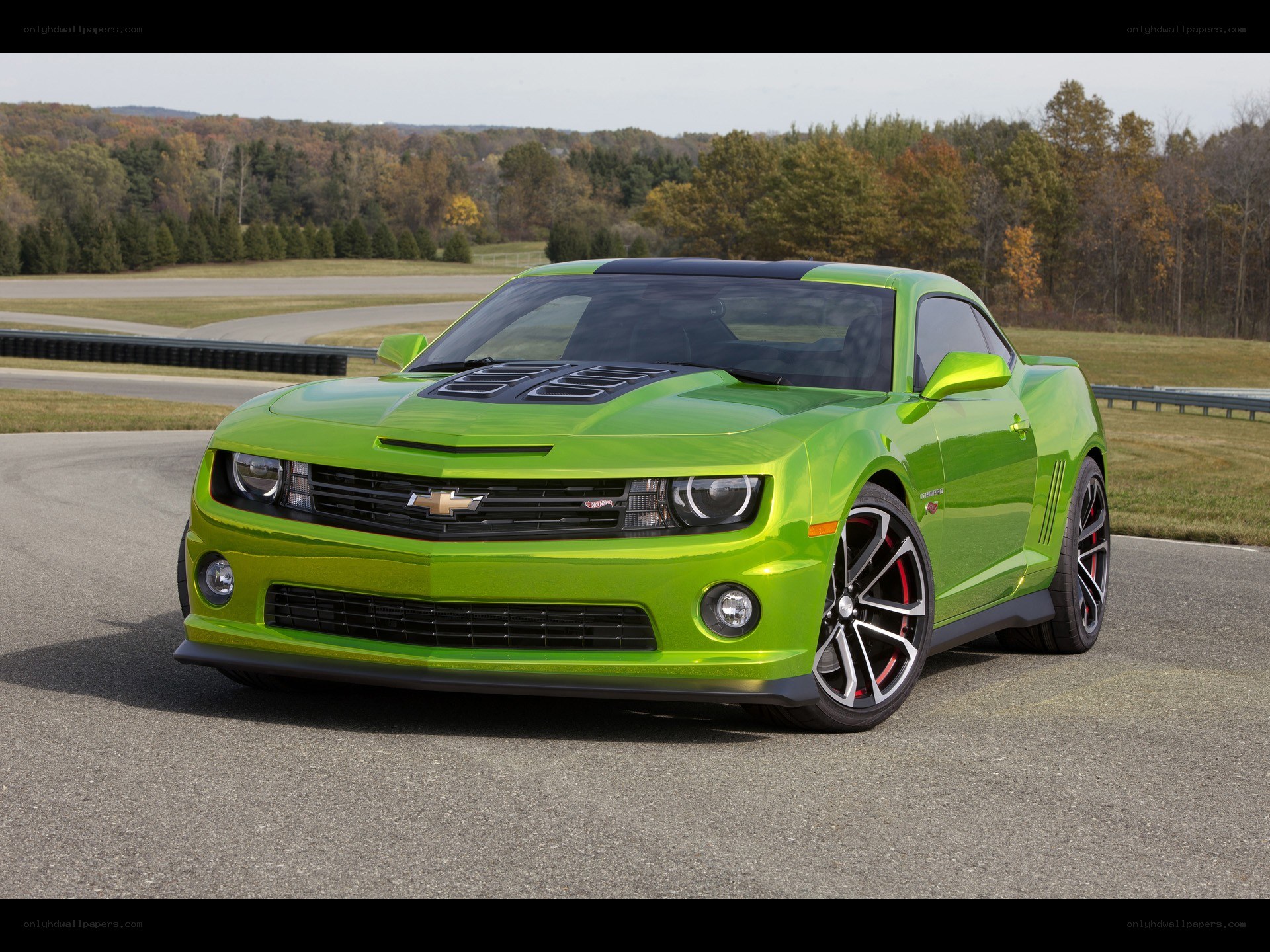 Green Chevrolet Camaro on racetrack