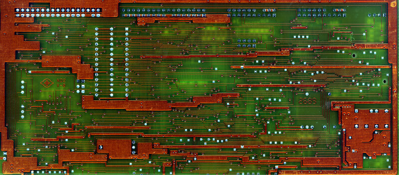 green circuit board with copper traces