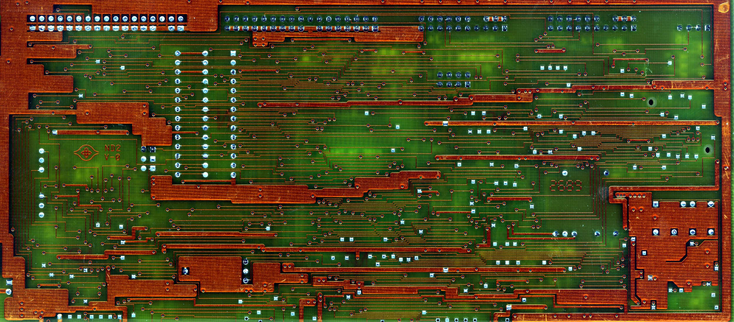 green circuit board with copper traces