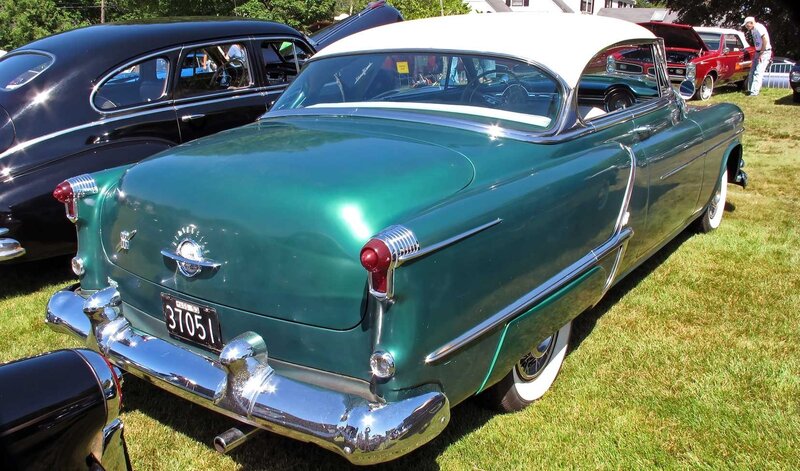 Green classic car at a show