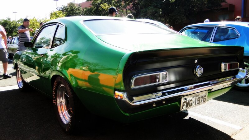 Green classic car at a show