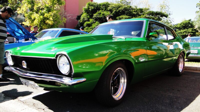 Green classic car at a show
