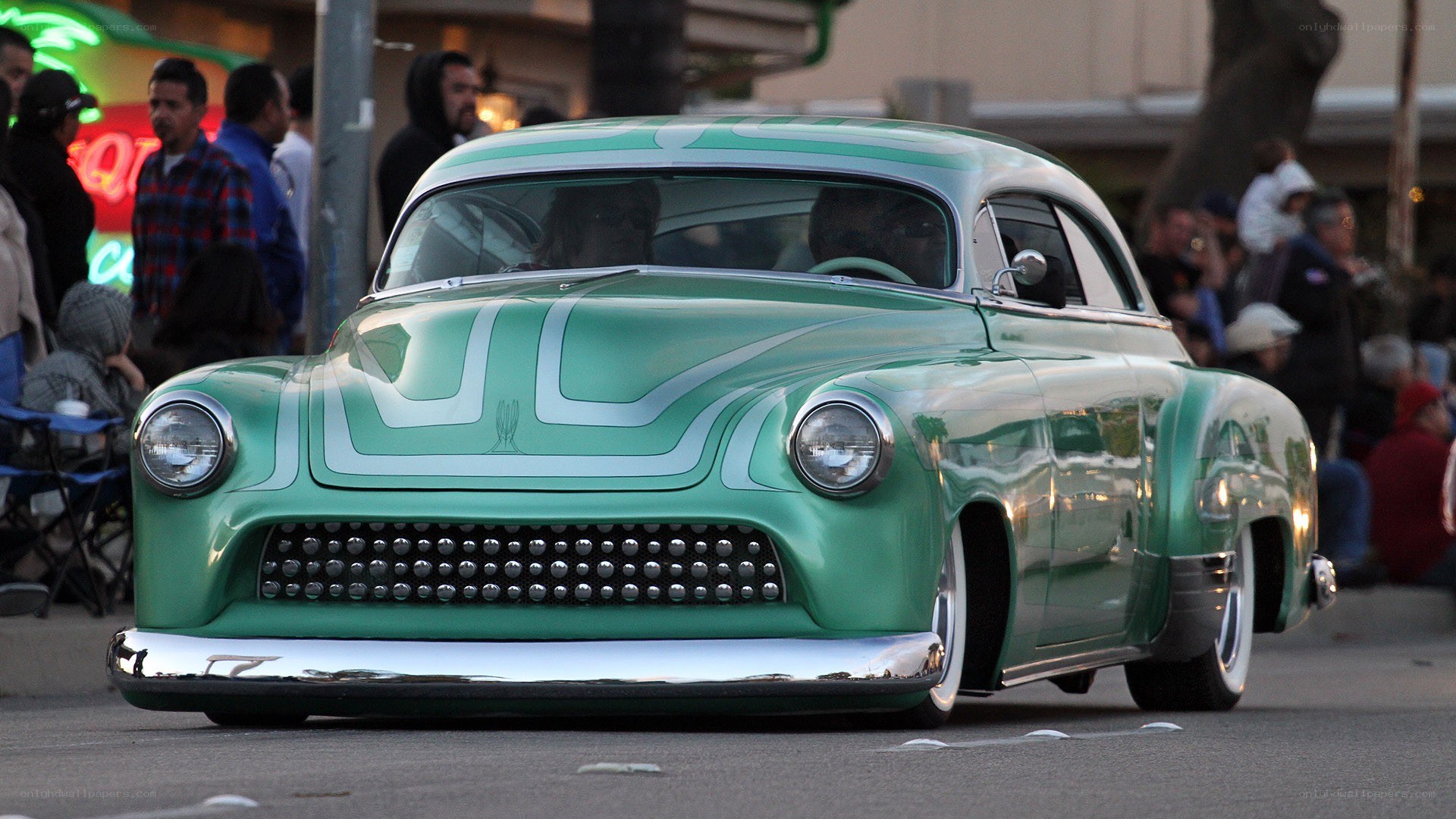 green classic car at night