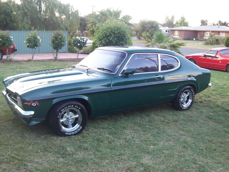 Green Classic Car — Calm, Afternoon, Photograph, Red Car