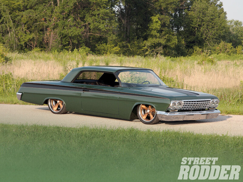 green classic car on road
