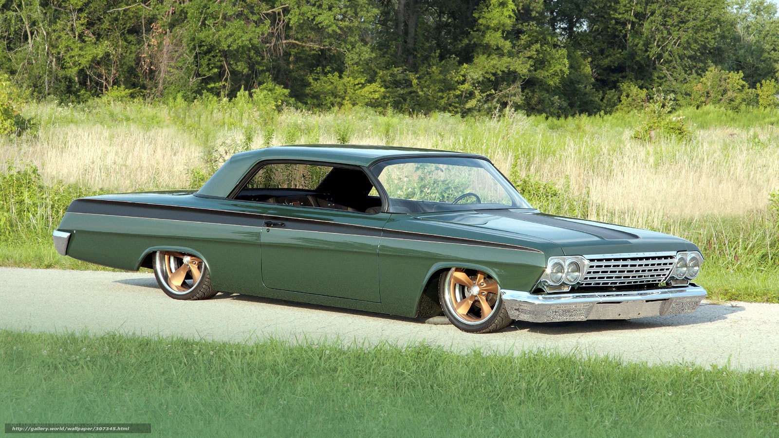 green classic car on road