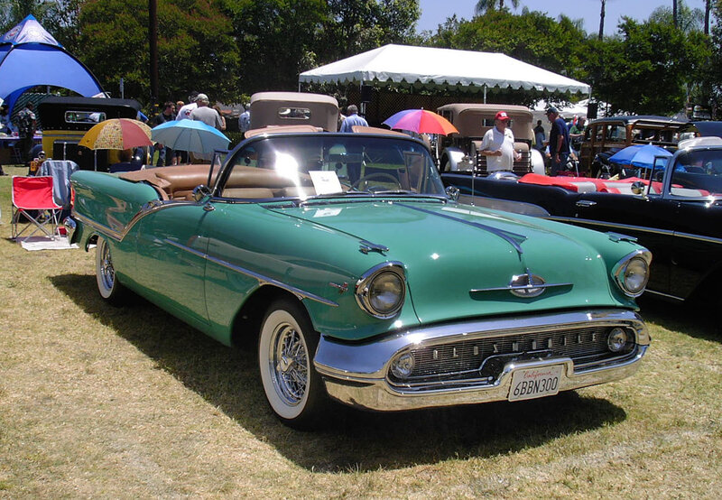 Green classic convertible at car show