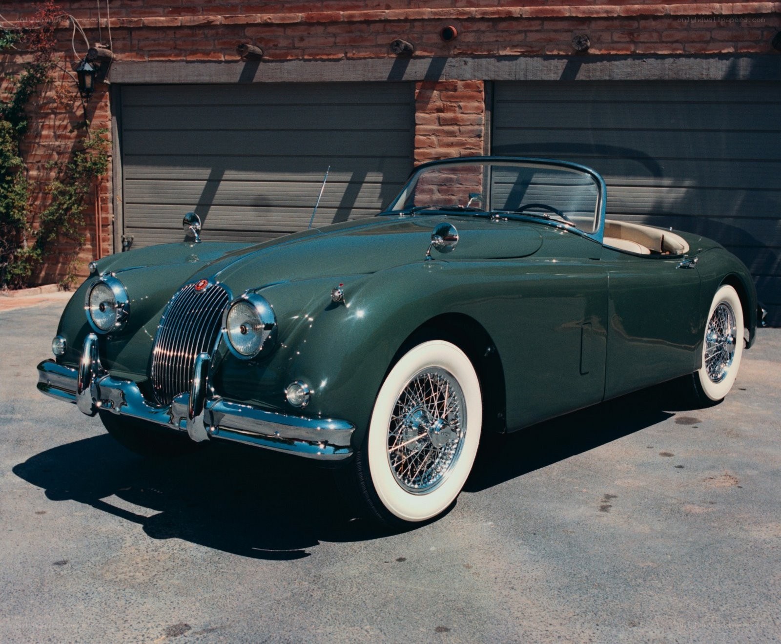 Green classic Jaguar convertible