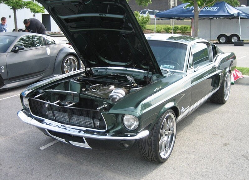 Green classic muscle car at show