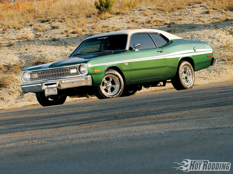 Green classic muscle car on road