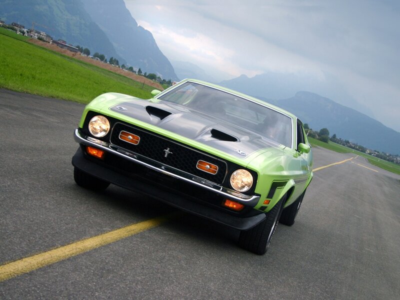 Green classic muscle car on runway