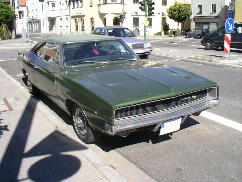 Green classic muscle car on street