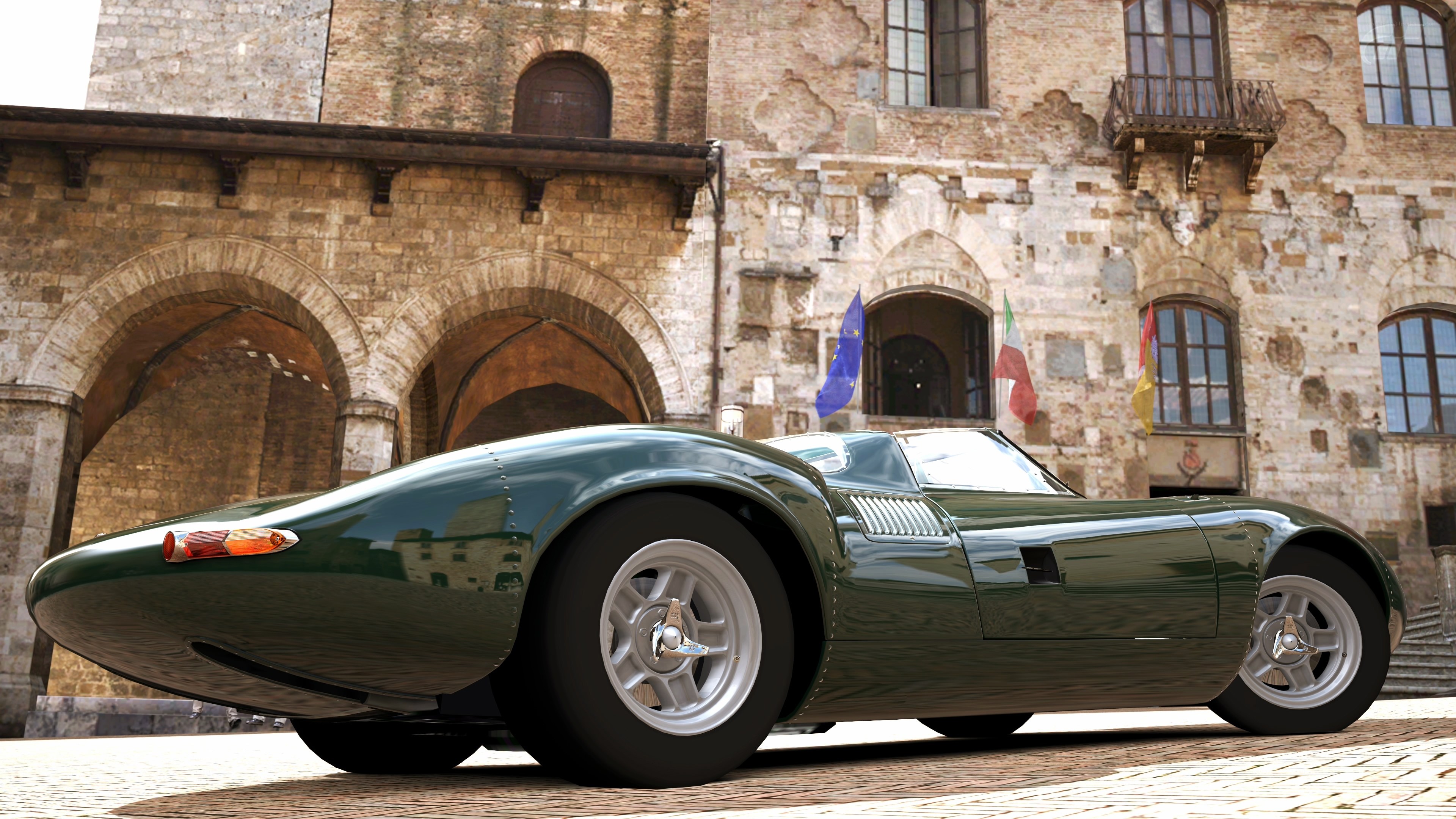 Green classic race car in Italy