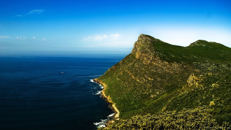 Green Cliff Overlooking Ocean — Blue, Serene, Afternoon