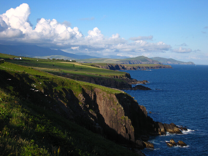 Green Cliffs by Ocean — Blue