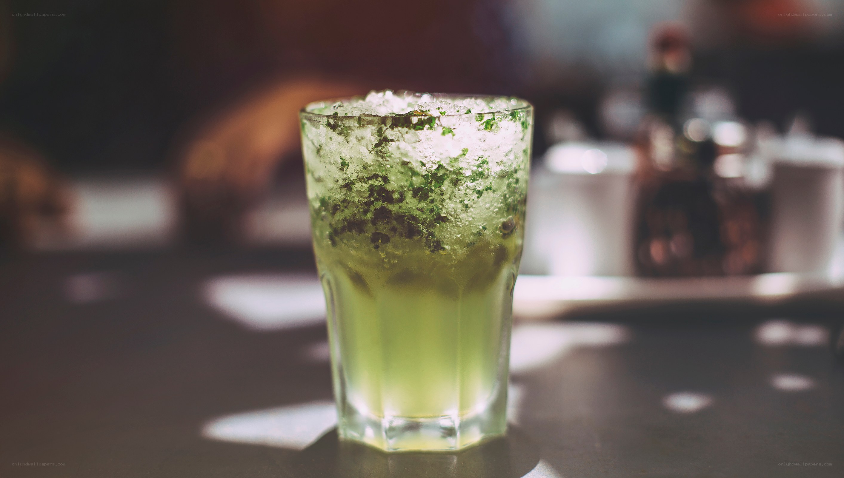 green cocktail in glass